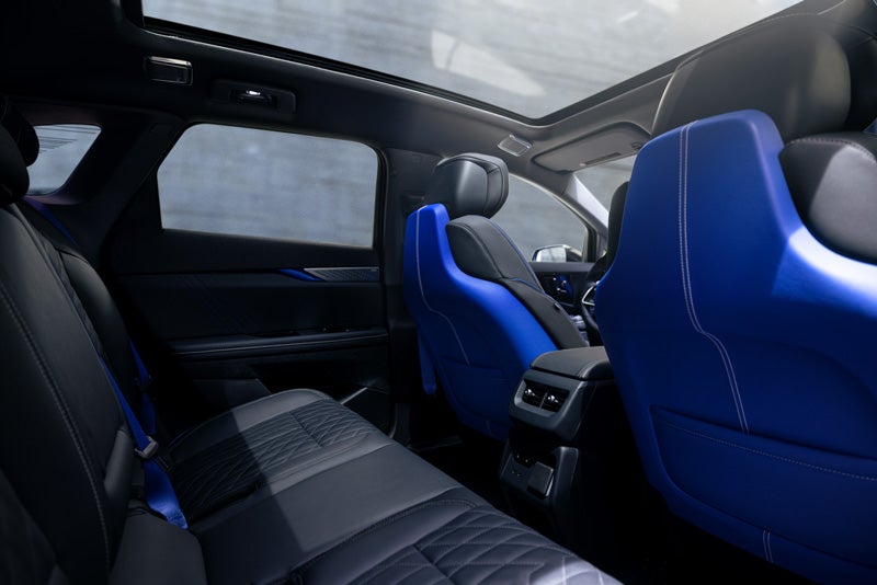 Back Seat View of the 2026 OPTIQ-V Blue Front Seats, Sun Roof, and Interior | Dossett Cadillac in HATTIESBURG MS